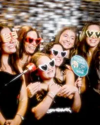 A group of friends and family posing for a private party.