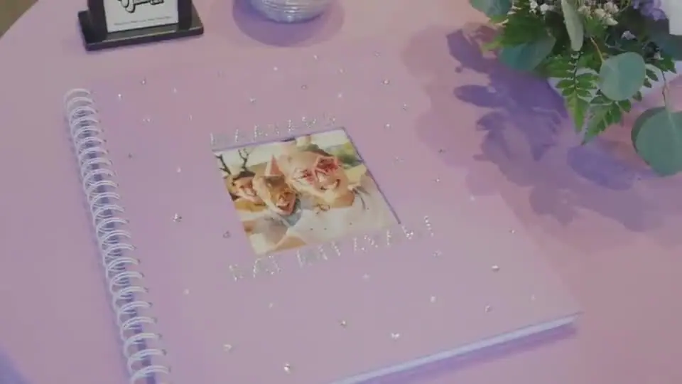 Photo booth memory book on the guest table