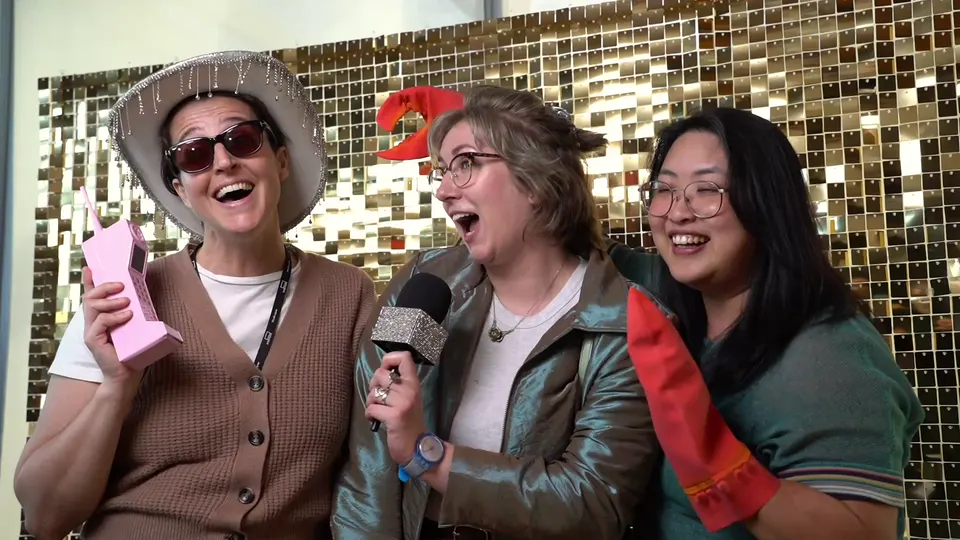 Coworkers laughing and posing at the Viva photo booth during company events