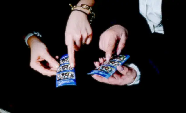 Guests pointing at each other on their custom-printed photo strips